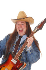 Middle age man standing playing the guitar and singing