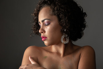 Beauty portrait of african american woman with afro hairstyle and glamour makeup