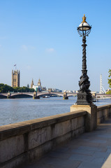 Fototapeta premium London Eye and the Houses of Parliament seen from the south bank of the River Thames, London, England