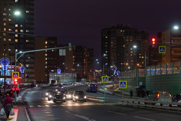 Fototapeta na wymiar Evening New Moscow. The road through the Kommunarka. Alexandra Monakhova Street.