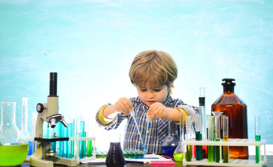 Little kids scientist earning chemistry in school lab. Knowledge day. School chemistry lessons. First grade. Chemistry The Science Classroom. Little children at school lesson