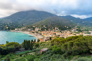 Fototapeta na wymiar Levanto Town in Italian Liguria as seen as seen from the slope of Mesco Mounting.