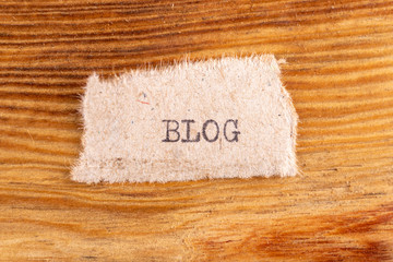 The word "blog" typed. The inscription on a gray sheet of pappier.