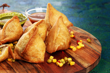 Vegetarian samsa or samosas.Indian special traditional street food fried punjabi samosa or Coxinha, Croquete and other Fried Brazilian Snacks