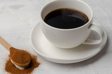 Cup with chicory drink on cement background. Healthy drink replacement coffee.