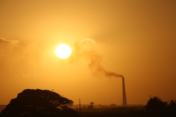 Sunset behind the factory