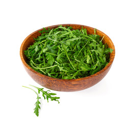 Arugula leafs in a wooden bowl