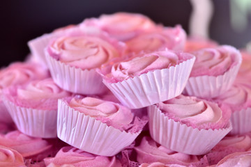 party chocolate candies in pink packaging on defocused background