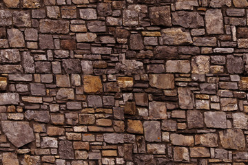 seamless texture of the old stone wall for the designer, brown gray background