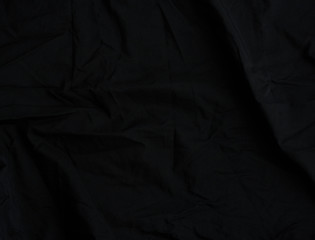 texture of black cotton fabric with waves, full frame, fabric for sewing clothes