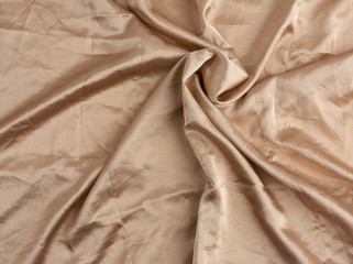 beige satin textile fabric, piece of canvas for sewing curtains and things