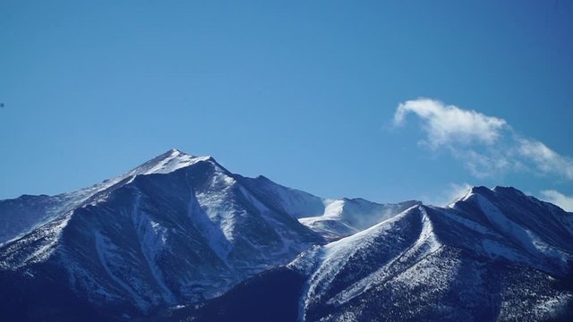 Clouds in blue sky moving over Mount Princton of the Rocky Mountains, time lapse