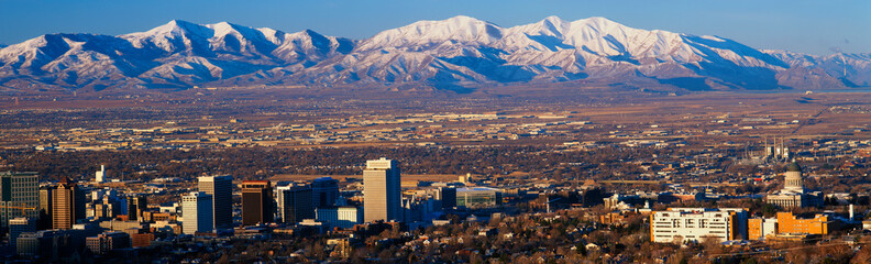 This is the State Capitol with the Great Salt Lake and snow capped Wasatch Mountains in morning light. It will be the winter Olympic city for the year 2002. - obrazy, fototapety, plakaty
