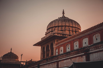 Domes of old palaces in India in the light of the setting sun