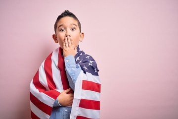 Young little patriotic boy kid covered on united states of america flag on independence day cover...