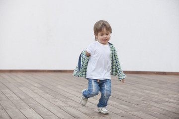 Happy boy runs around the stage. Blurred image - 316641325