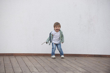 Happy boy runs around the stage. Blurred image - 316641339