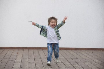Happy boy runs around the stage. Blurred image - 316641372