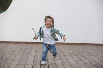 Happy boy runs around the stage. Blurred image - 316641390