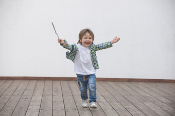 Happy boy runs around the stage. Blurred image - 316641392