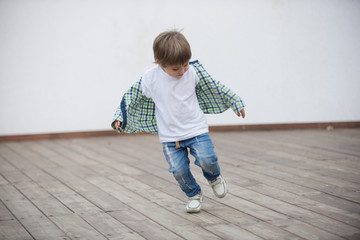 Happy boy runs around the stage. Blurred image - 316641556