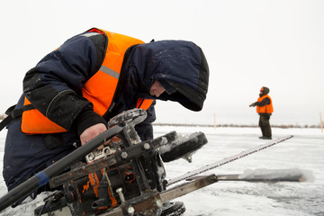 Portrait of a worker repairing equipment in extreme conditions