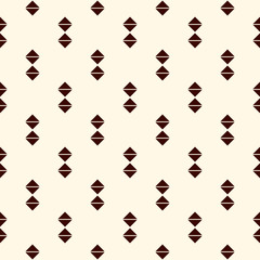 Fototapeta premium Repeated mini triangles on white background. Simple abstract wallpaper. Seamless pattern design with geometric figures.