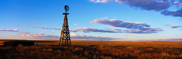 This is an old wooden windmill along Route 60. It is an RMotor windmill in sunset light.