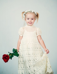 love present. childrens day. little girl in vintage dress. Beauty. small kid with red rose. happy childhood. valentines day. romantic date. retro style. happy birthday. wedding. True love