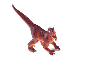 Toy dinosaurs isolated on white background.Copy space