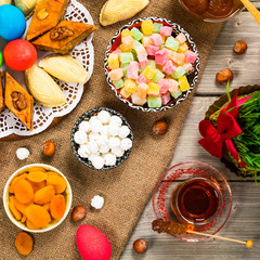 Novruz Ramadan in Azerbaijan. Colored Eggs, Wheat Springs for Easter and Traditional Sweets. Selective focus.