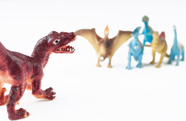 Toy dinosaurs isolated on white background.Copy space