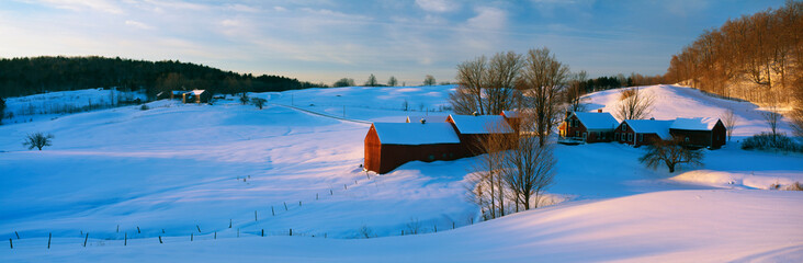 This is the Jenne Farm at sunrise. The surrounding countryside is buried in snow. It is...