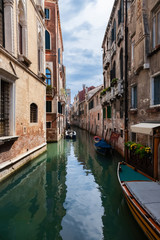 Obraz na płótnie Canvas Typical Venice narrow canal with boats. Italy