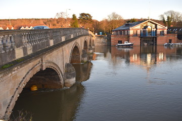 Stone five arch bridge over river Thames between Oxfordshire and Berkshire. The stretch of river between the regatta finish and Henley bridge is the location for annual town festival of music and arts