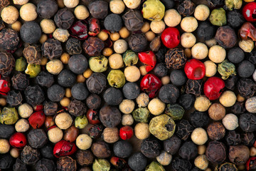 Closeup of mixed pepper background. Top view.