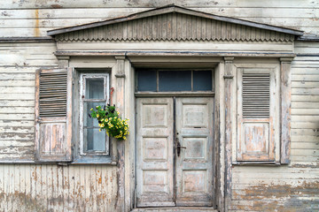 Fototapeta na wymiar Facade of old white wooden home