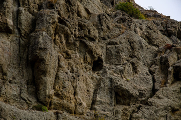 Mountain landscape. Sheer cliff and sky. Travel and adventure.