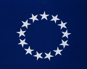 This is a flag with 13 stars sewn in a circle in a field of blue. This was the Original Colonial...