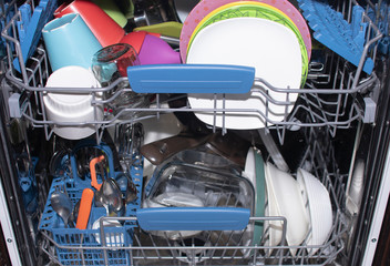 Clean dishes in an open dishwasher