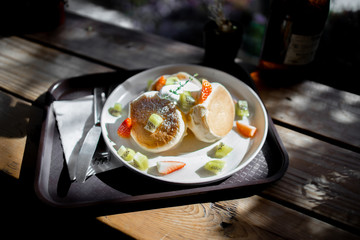 Fluffy Pancakes Toasted with strawberry, kiwi fruit, foaming smoothie served with honey syrup
