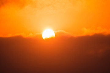 The sun is floating in the sky.