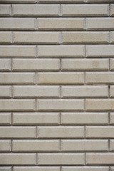 gray yellow brick wall background in outside, vertical stock photo image