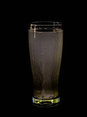 Fresh and cold drink isolated on black background