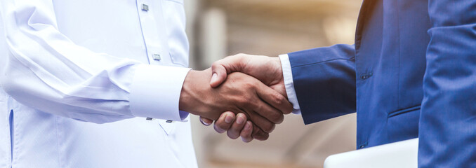 Successful businessmen handshake partner with arab businessman