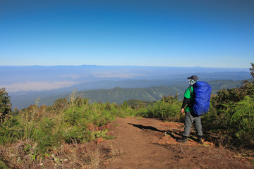 Naklejka premium Man hiking Traveler with big backpack mountaineering Travel Lifestyle