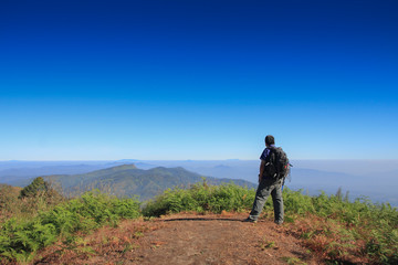 Fototapeta na wymiar Man hiking Traveler with big backpack mountaineering Travel Lifestyle