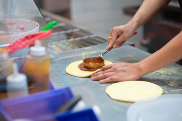 Worker making pizza in the restuarant