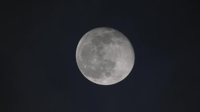 Moon on cloudy night seen from a 600mm refractor telescope at near Zenith