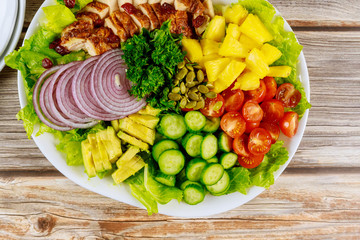 Fresh vegetable salad with roasted chicken breast, tomatoes, cucumbers. Healthy food concept.